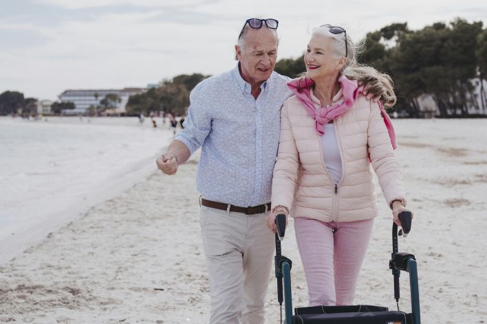 Senior couple walking at the beach